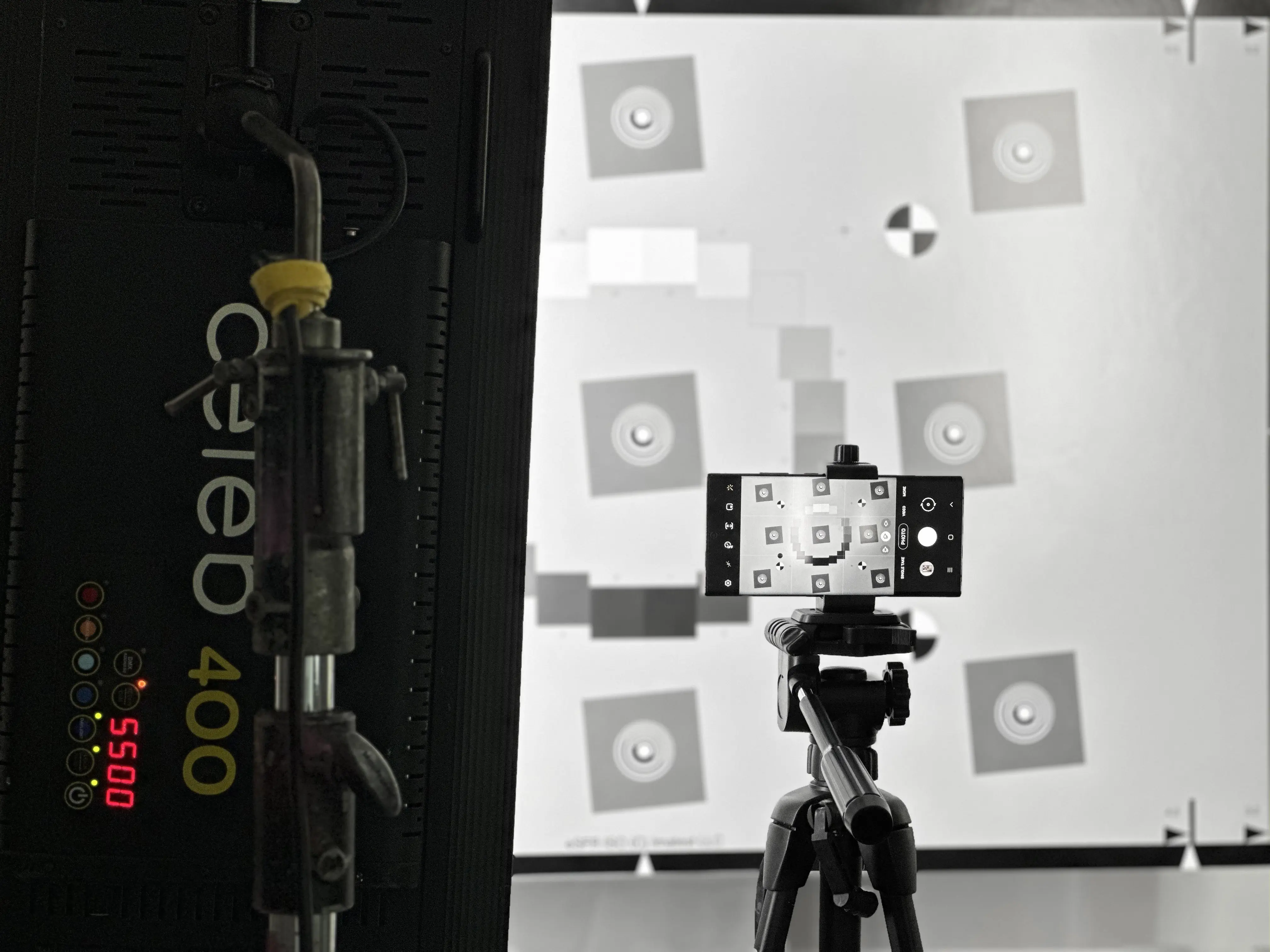 Camera calibration board with color charts and imaging test targets